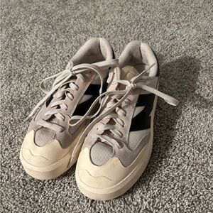New Balance Cream and Black Sneakers